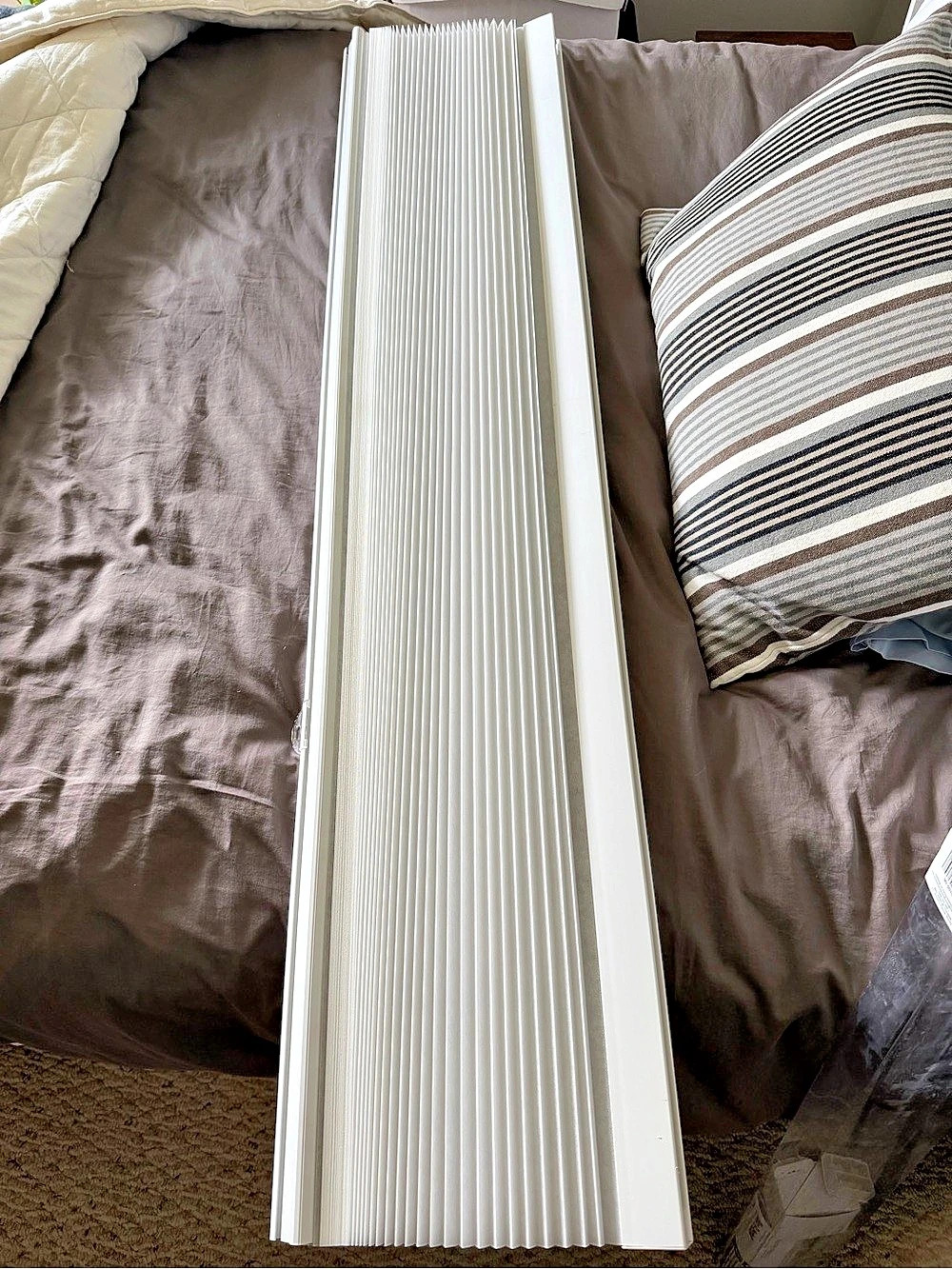 white pleated window shade